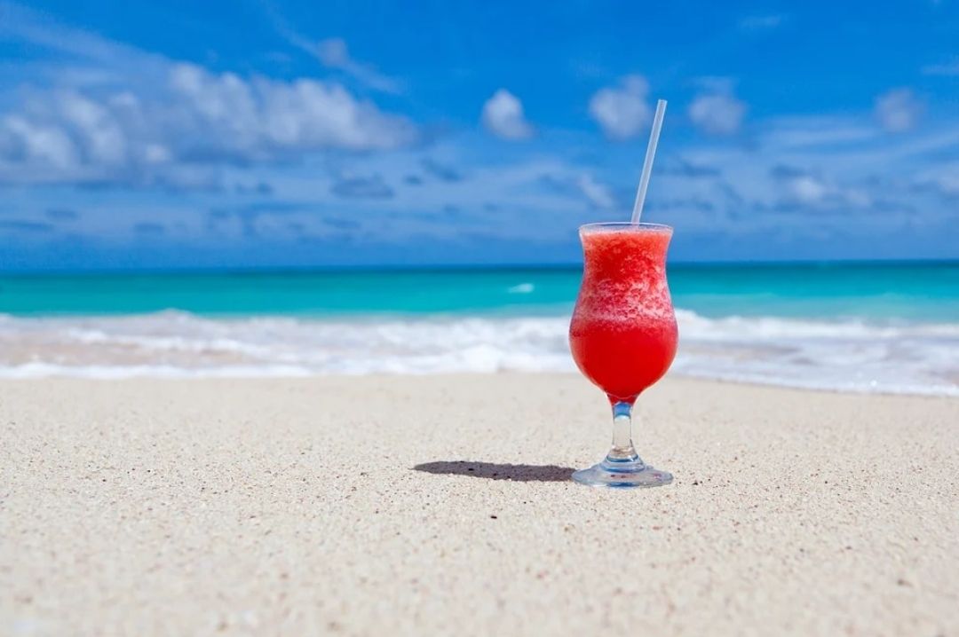 Tropical Cocktails in a Hurricane Glass pina colada